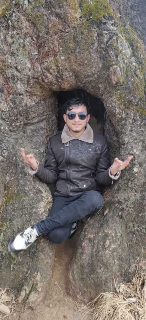 Nepali Boy Wilson Shrestha finding peace inside the tree, praying 